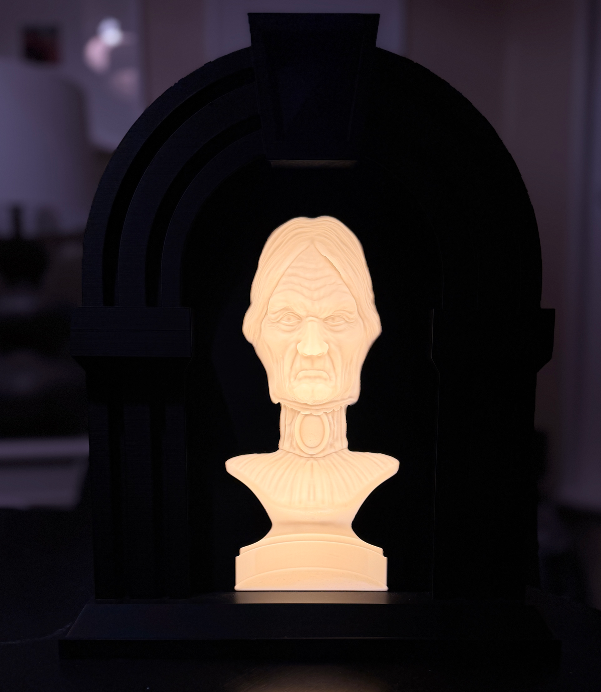 an led backlit bust of an old woman